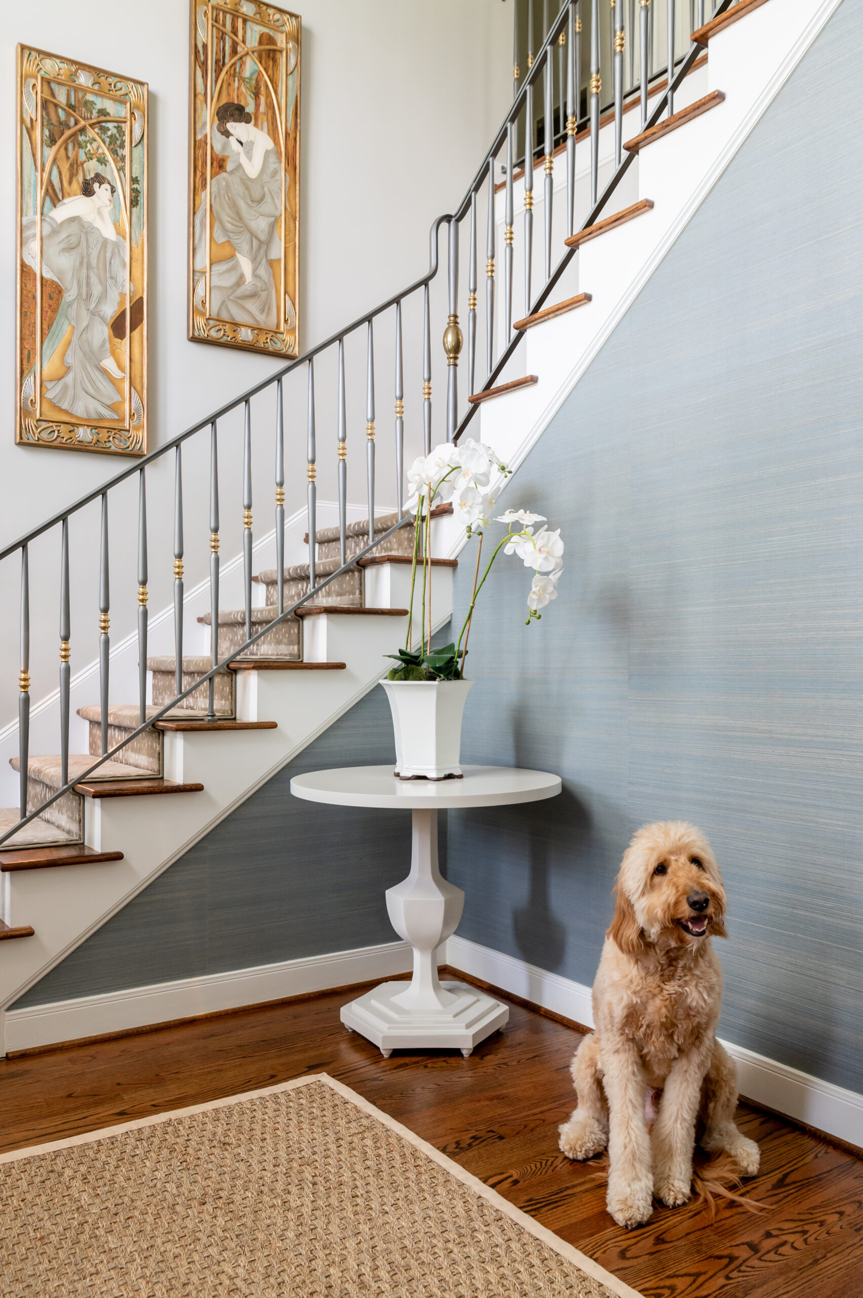 Entryway interior design with puppy sitting by staircase