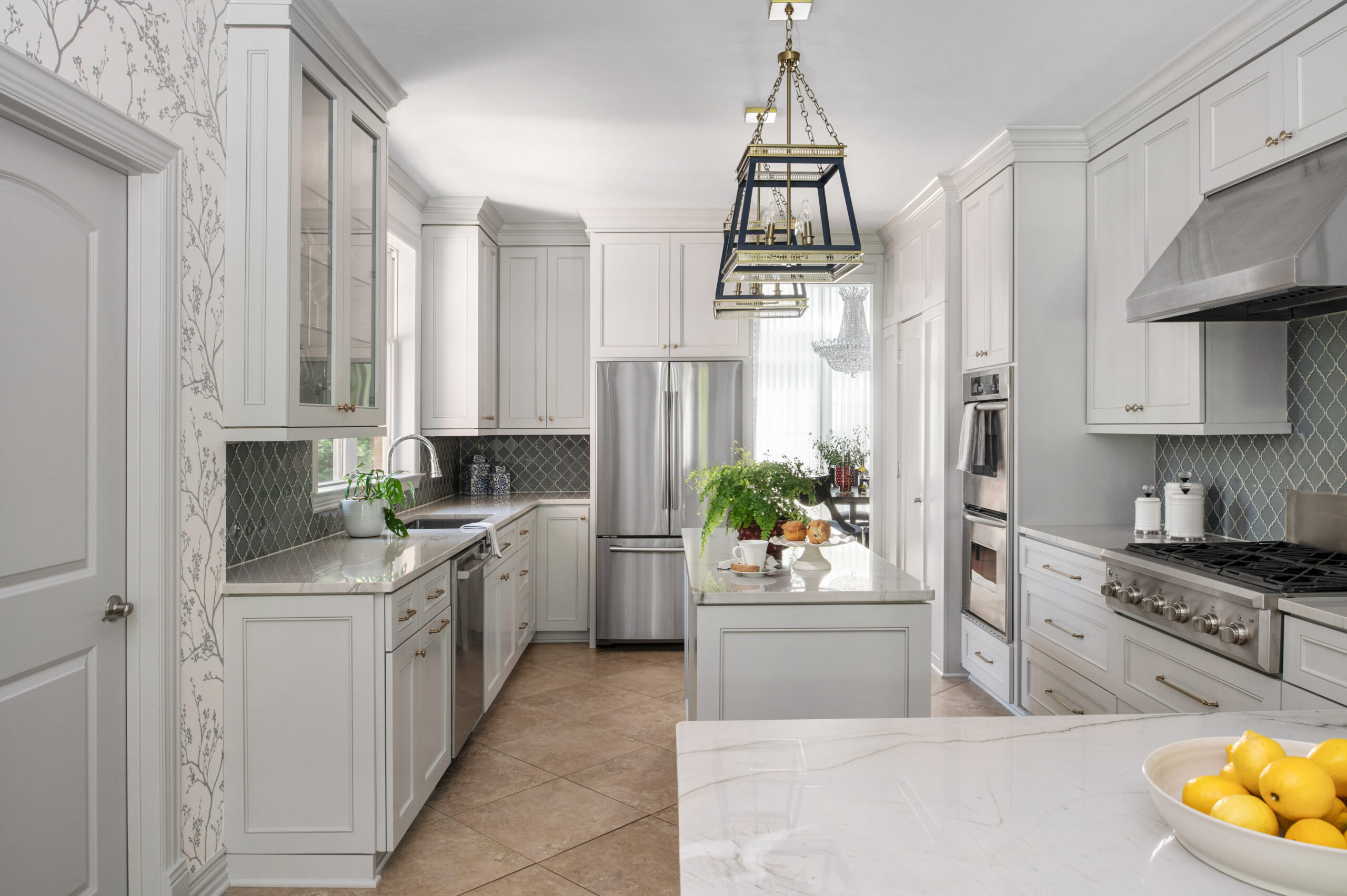 Sleek white kitchen interior design with white marble counters