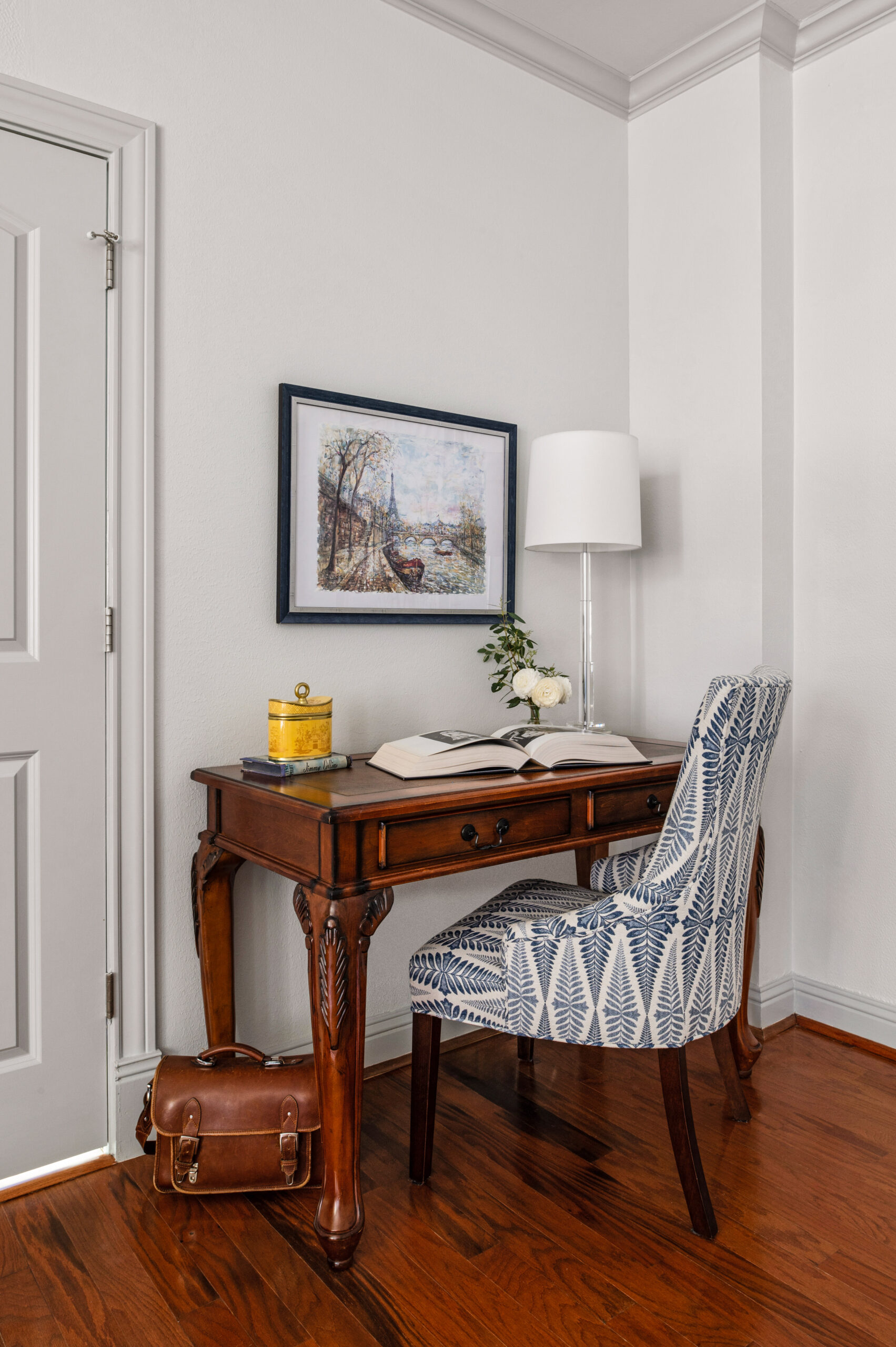 Bedroom interior design photos of a wooden table and chair taken by a houston interior photographer