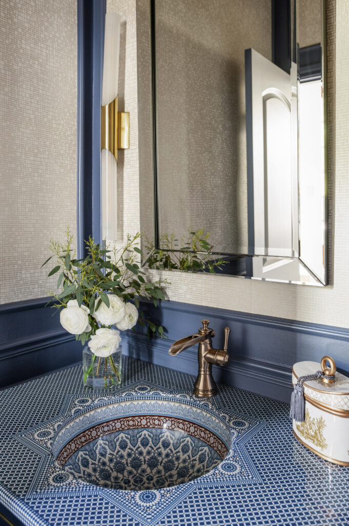 Bathroom interior with blue vanity and blue walls