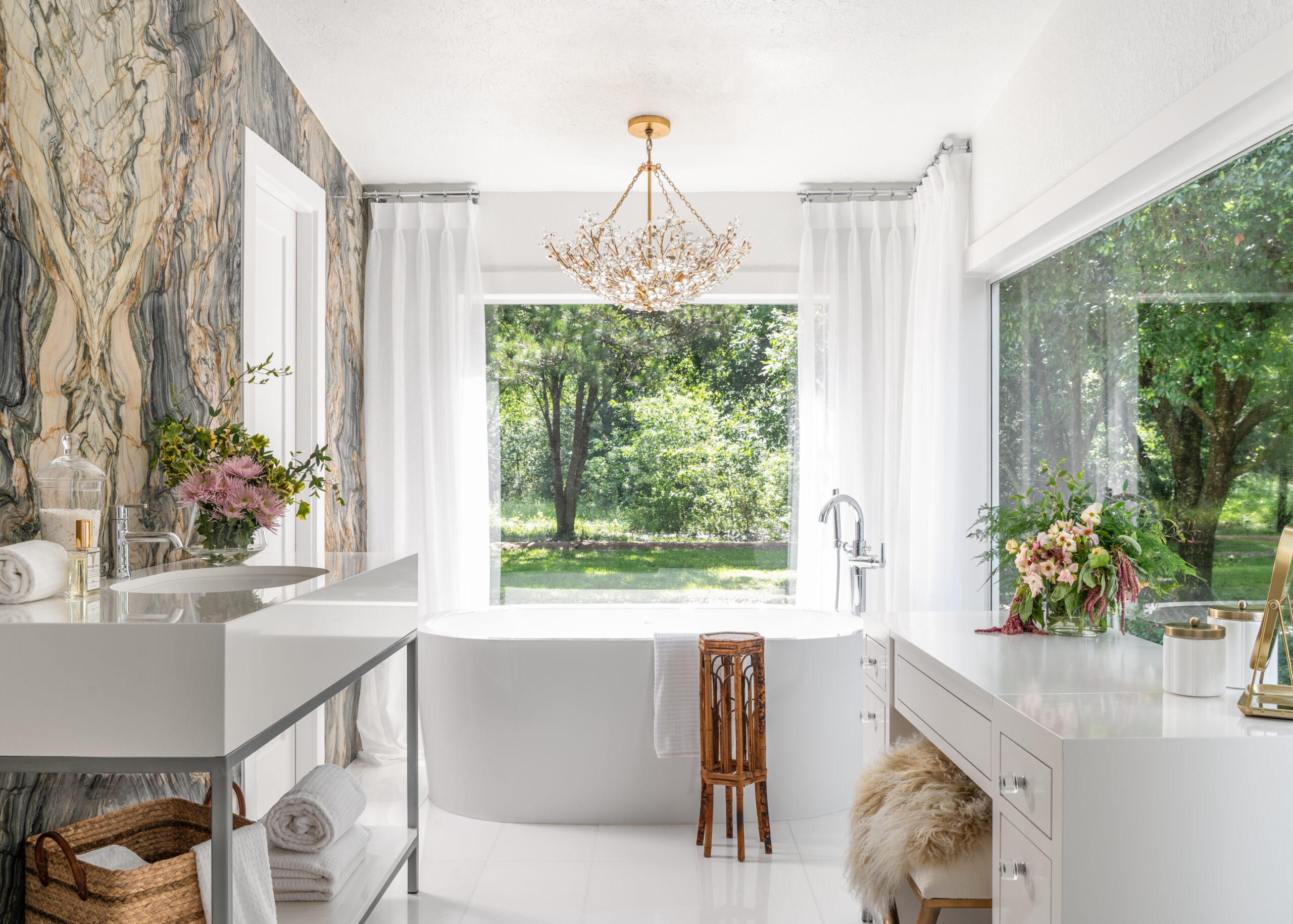 Luxury bathroom interior design with marble walls and spacious tub