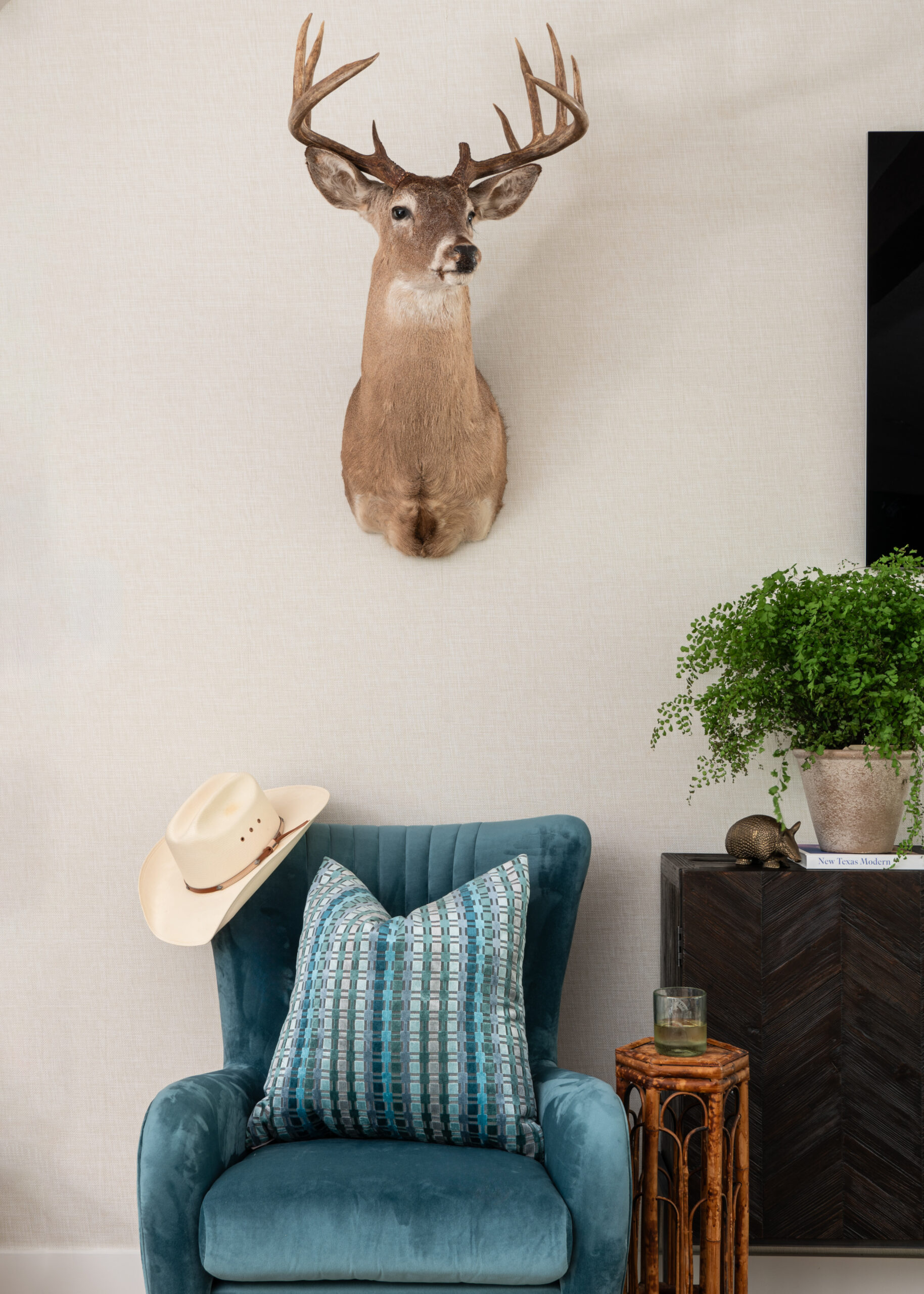 Modern home interior design decor with deer head and love seat