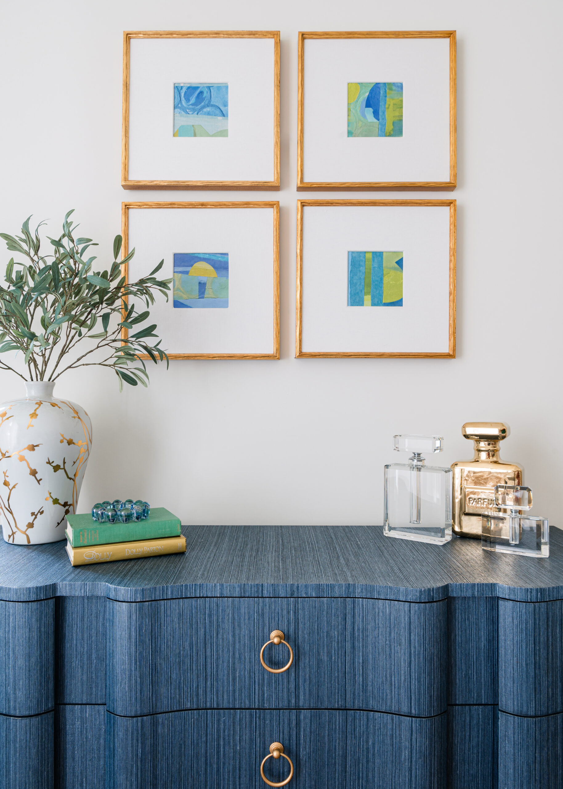 A stylish dresser with modern gold decor, highlighting the mix of textures and finishes that define Texas interior design.