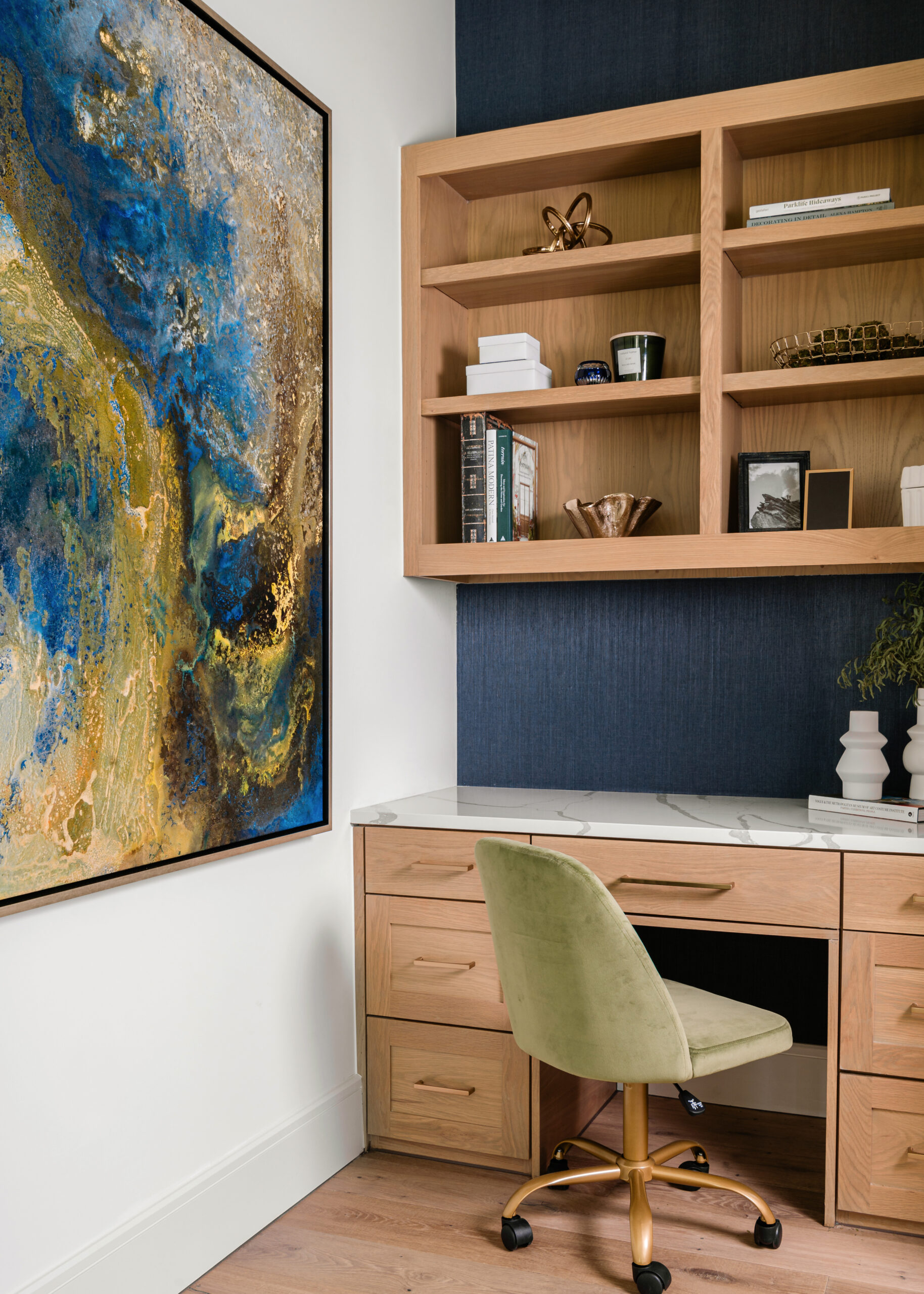 Bright and stylish home office: A modern home office with light-toned furniture, pops of green and yellow, and built-in shelving, featuring bold artwork that ties the room together.