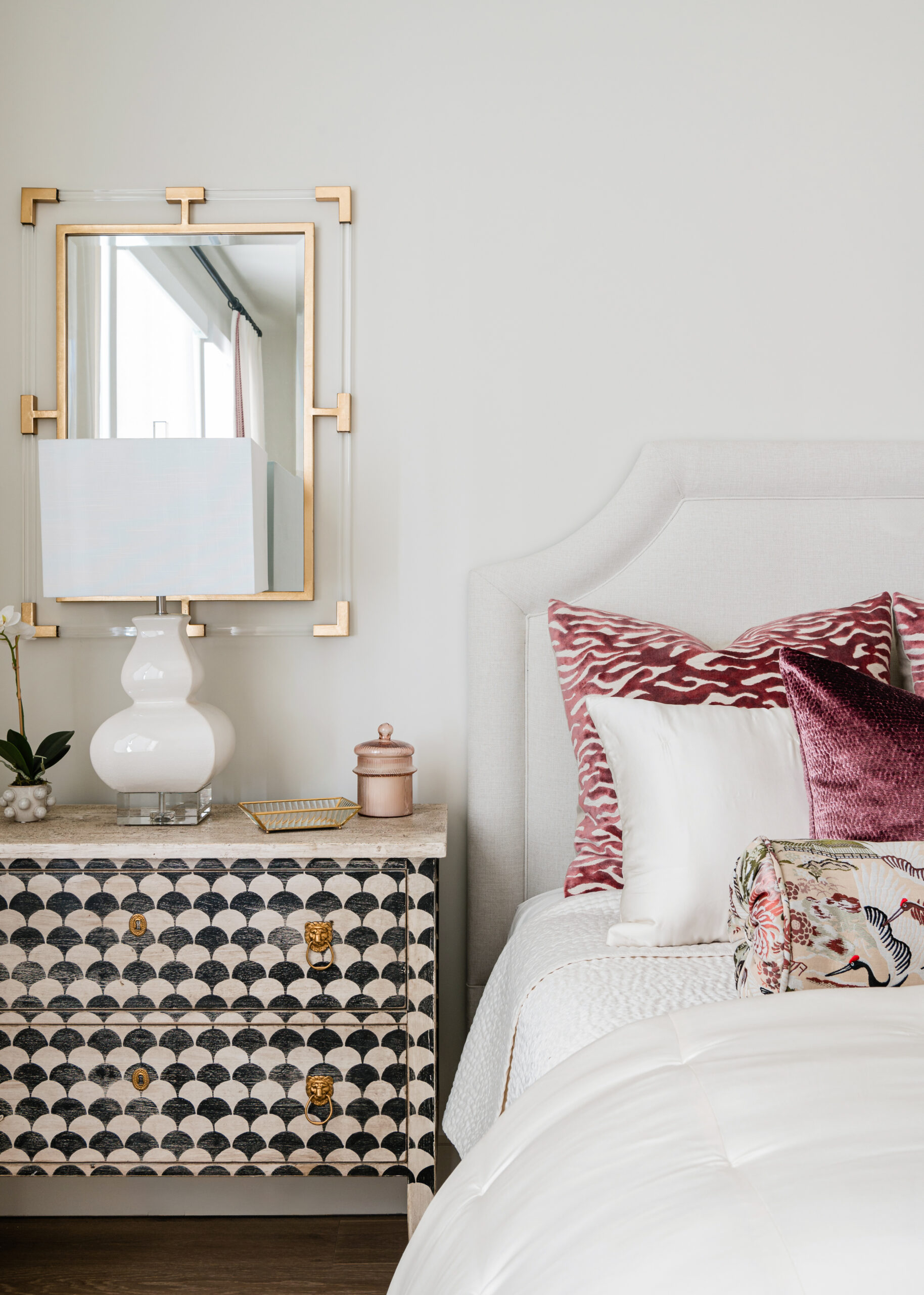 A bedside table with bold patterns and rich textures, reflecting the attention to detail and luxury seen in Texas interior design.