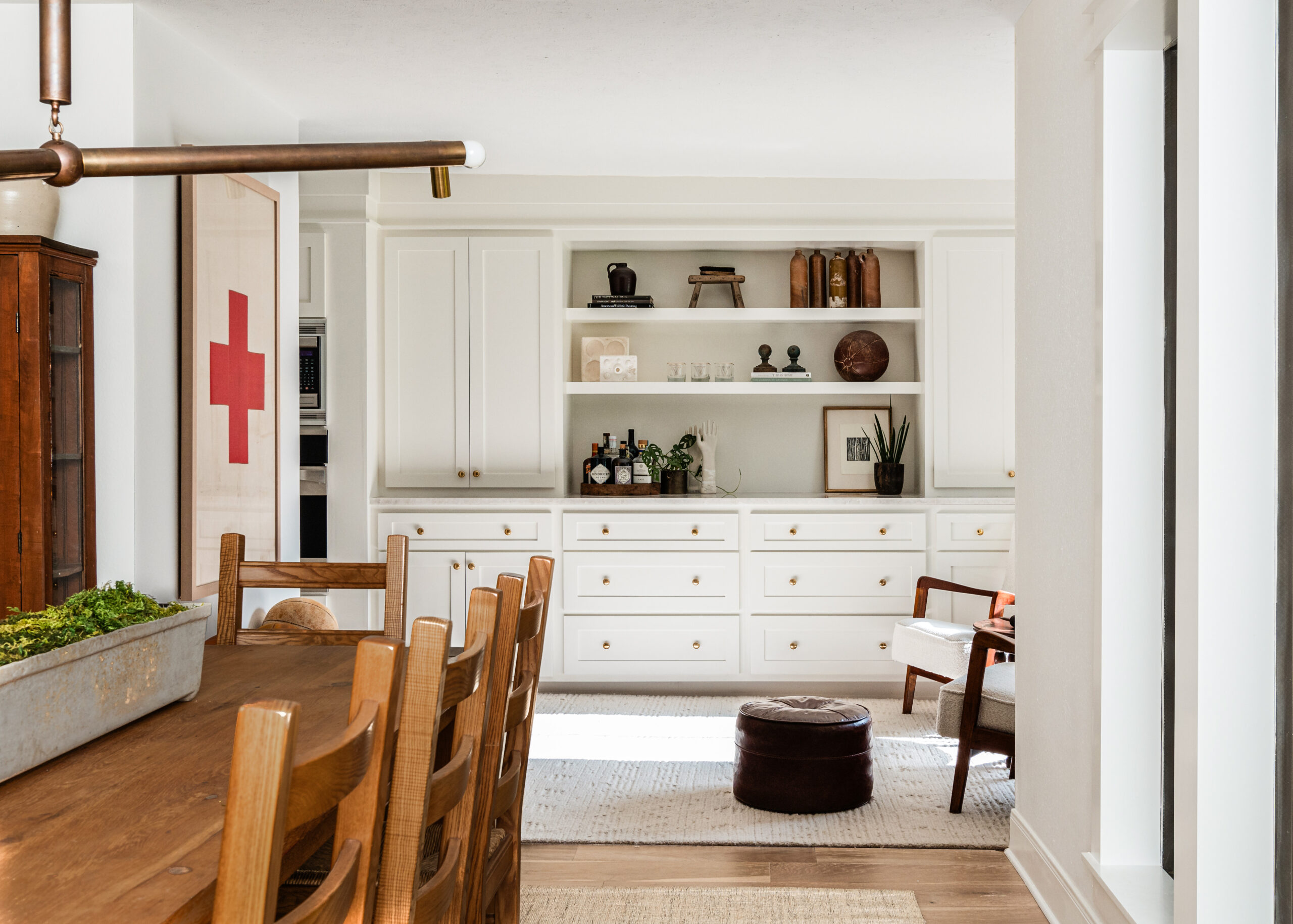 Dining room interior design with wooden dining table facing open living room layout