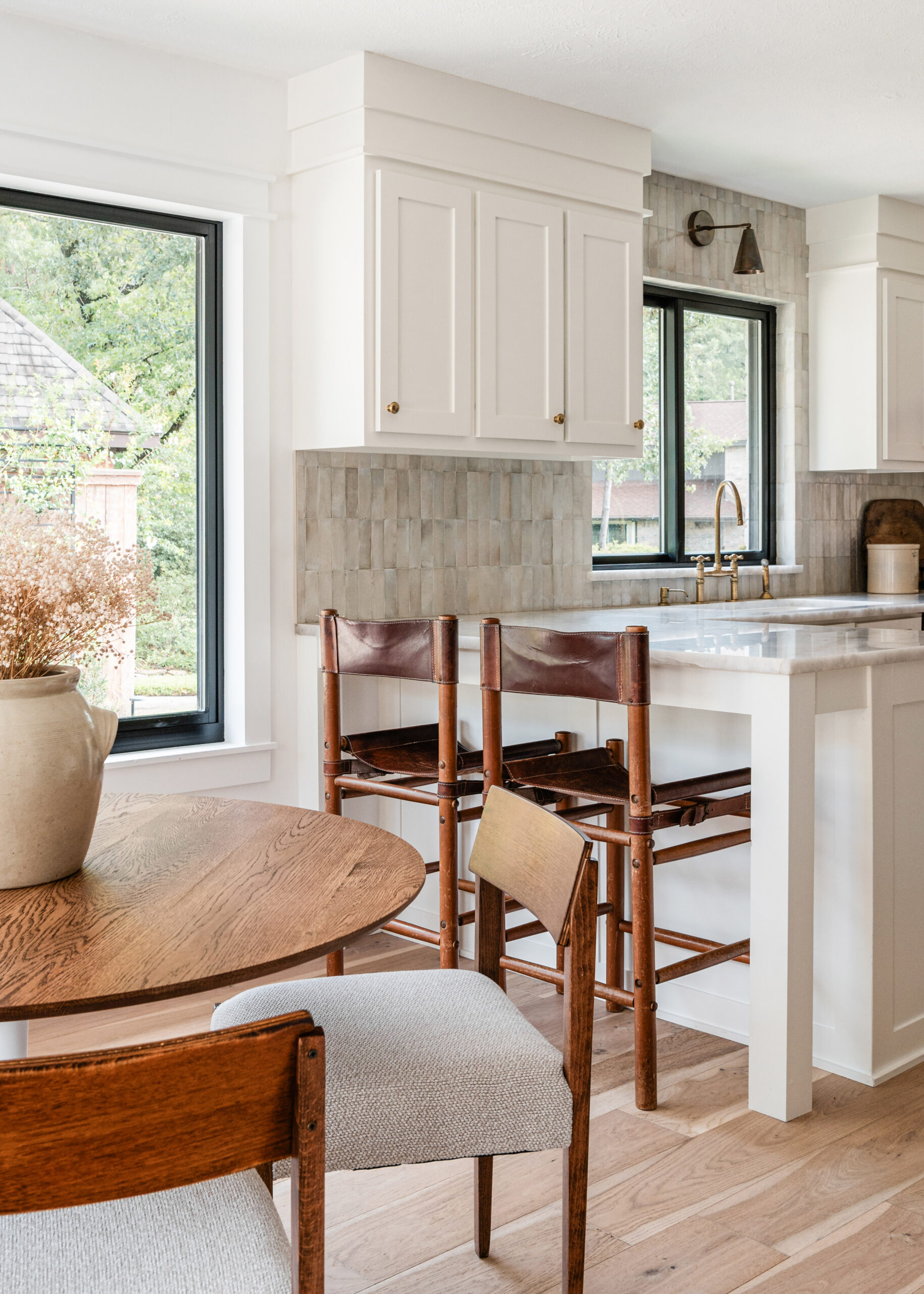 Living room interior design with wooden dining room table facing open kitchen layout