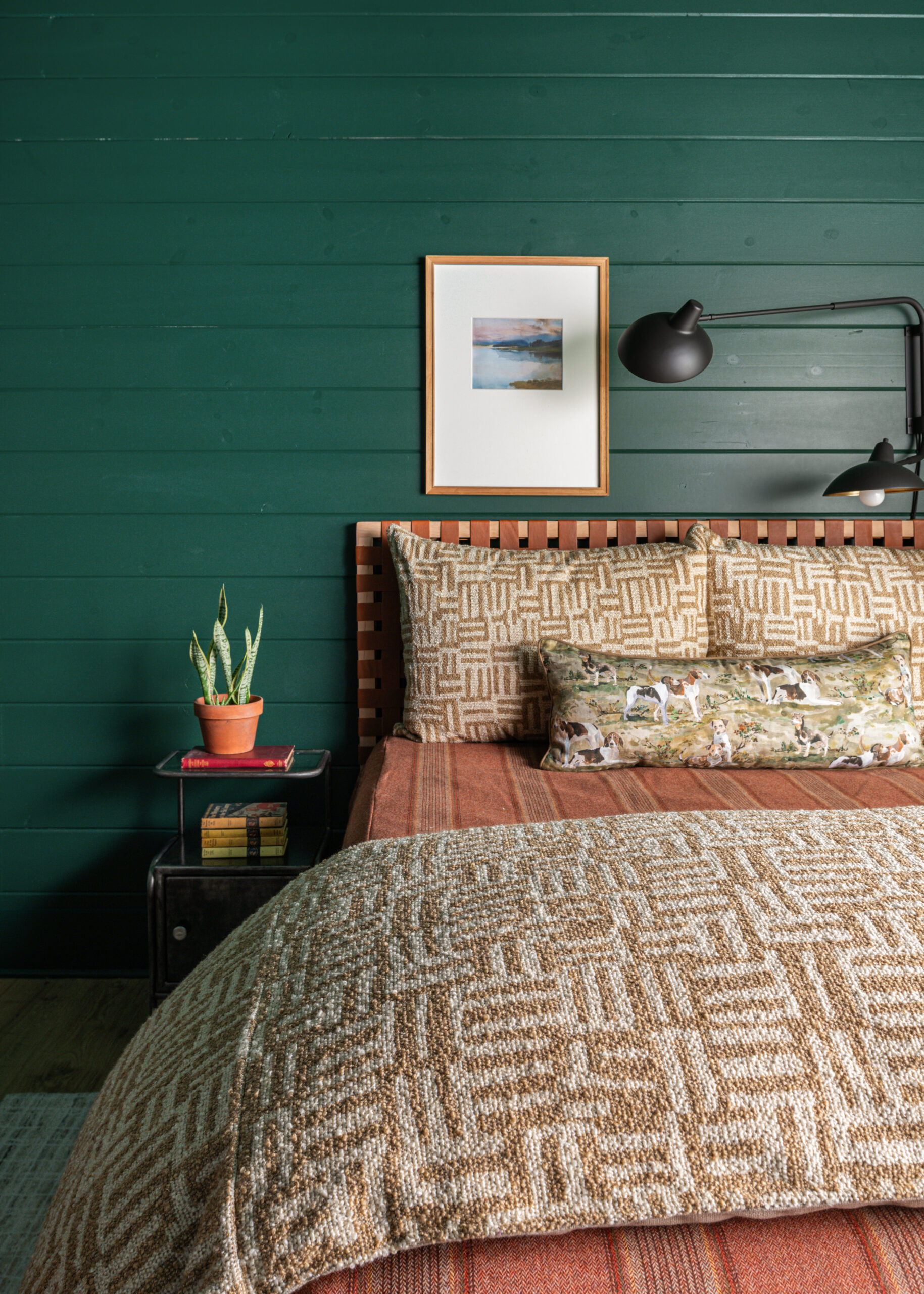 Cozy bedroom with vibrant green walls and thoughtfully designed custom interior design elements that bring warmth and personality to the space.