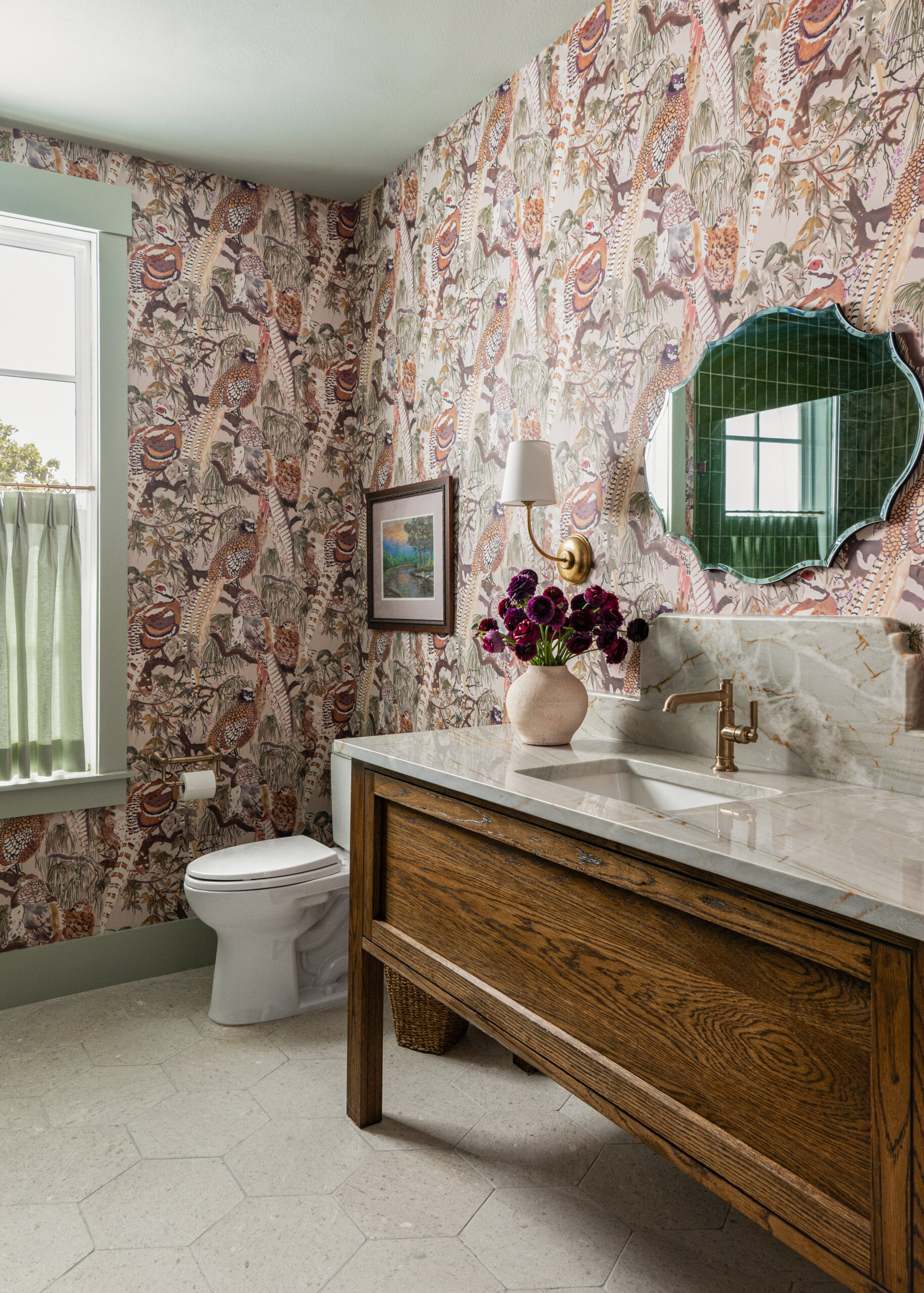 Custom bathroom design with unique wallpaper, natural stone, and gold faucets, capturing the essence of refined custom interior design for modern homes.