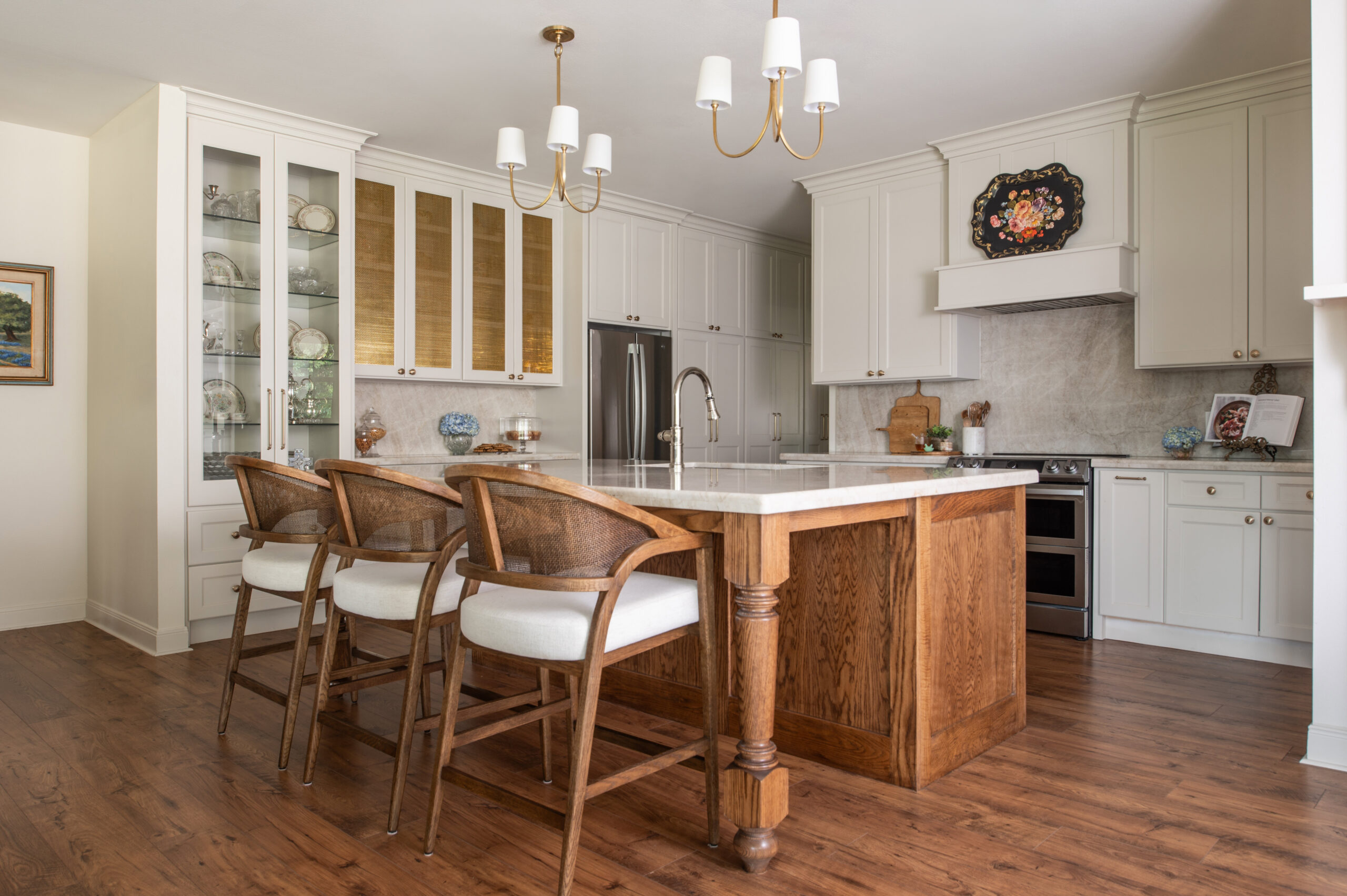 Sleek kitchen with a modern island, elegant wood accents, and contemporary bar stools, showcasing the essence of timeless modern interior design in a cozy home environment.