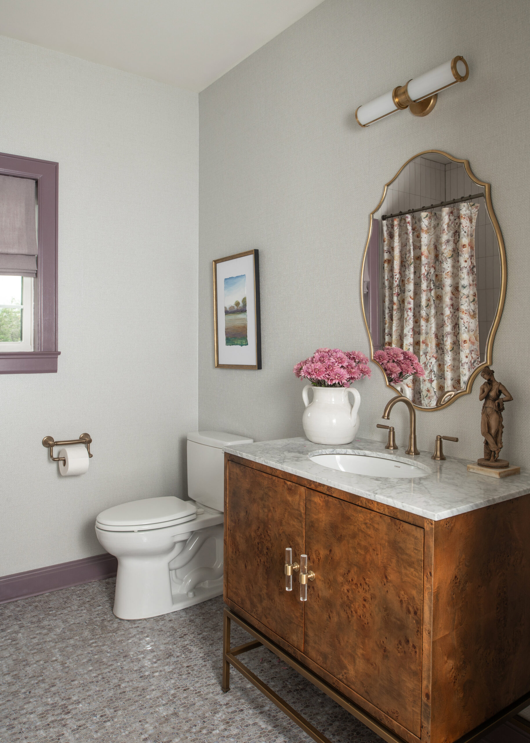 A bathroom with a marble vanity, elegant fixtures, and a neutral palette that makes the space feel serene and luxurious. The timeless modern interior design approach adds a sense of sophistication.