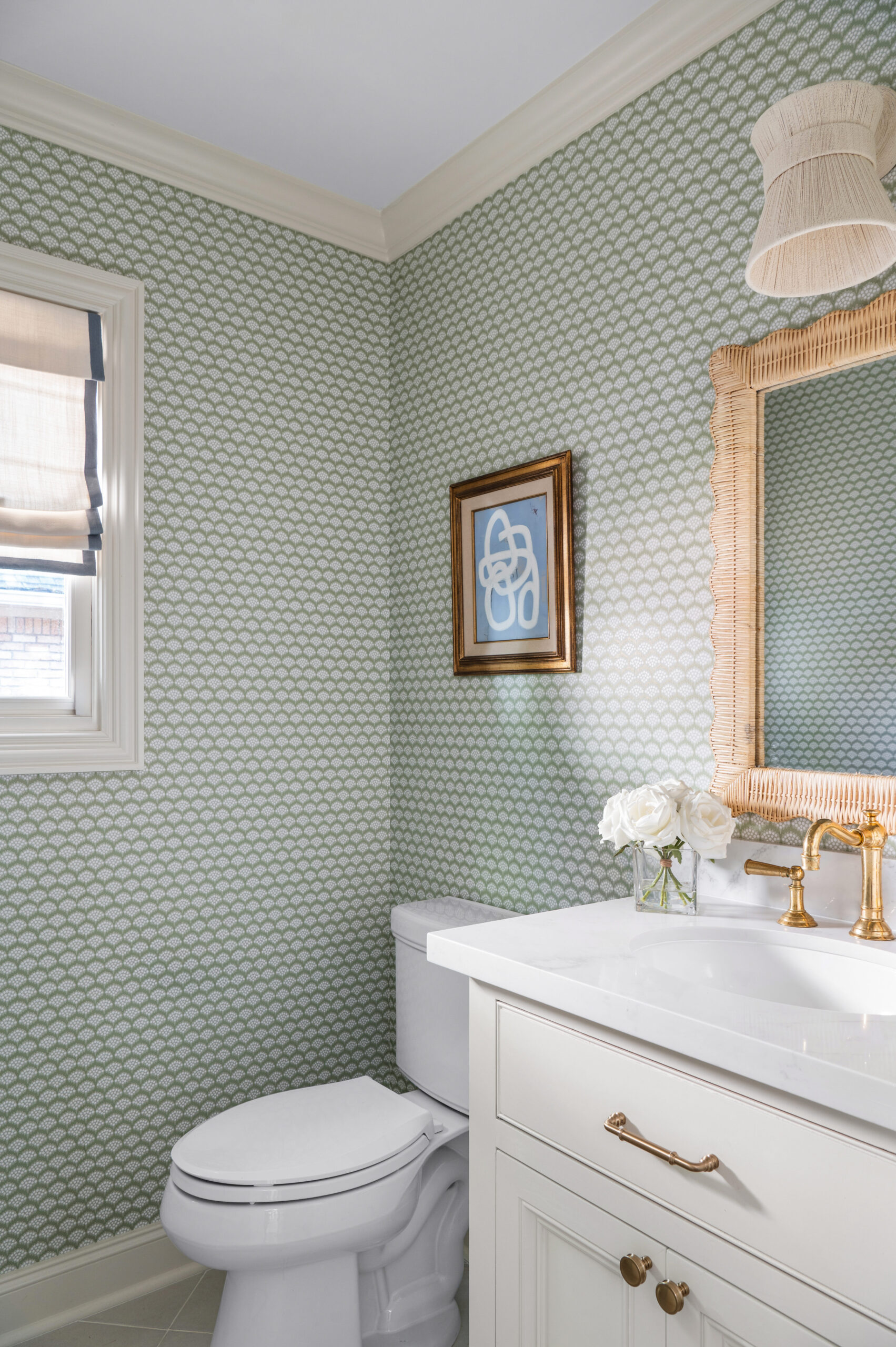  A serene bathroom featuring a textured mirror, gold fixtures, and fresh white roses, perfect for interior design publications that focus on minimal yet impactful bathroom décor.